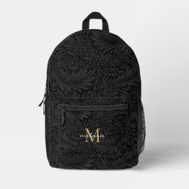 Elegant svart guld blommig scriptmonogram
