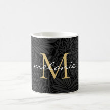 Elegant svart guld blommig scriptmonogram