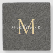 Elegant svart guld blommig scriptmonogram