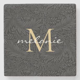Elegant svart guld blommig scriptmonogram stenunderlägg