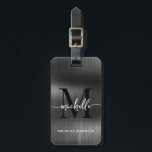 Elegant svart metallmonogram initial skriftstil bagagebricka<br><div class="desc">Flickig Stilren Modern Elegant Monogram Initial Namn Skript Svart Metall Anpassad Personlig Personlig Resväskemärke. Denna design har ett förnamn i en snygg handskriven svansfont med kalligrafi (eller typografi) med monogram initial, fullständigt namn, adressinformation på svart falsk metallisk folie bakgrund. Dessa är lätta att anpassa. Stilrent feminint present för bröllop, 16-års...</div>