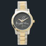 Elegant Tvåtons Monogram & Namn Brudtärna Gåva Armbandsur<br><div class="desc">En tidlös symbol för uppskattning, denna silver- och guldfärgade tvåtons klocka visar ett klassiskt grått monogram på en djup kolgrå bakgrund. De raffinerade vita skriptdetaljerna tillför en touch av elegans och säkerställer att denna vackra klocka fungerar både som en funktionell gåva och en stilfull souvenir från din speciella dag. Personalisera...</div>