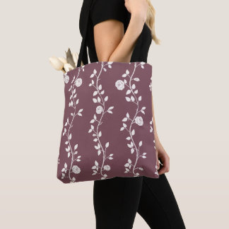 Elegant vit blomstergirlang mönster i mauve tygkasse