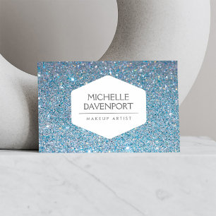 ELEGANT VITE EMBLEM PÅ BAKGRUND AV BLUE GLITTER VISITKORT