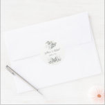 Elegant Watercolor Löv Bröllop Runt Klistermärke<br><div class="desc">En Elegant Watercolor Löv Bröllop Sticker designat med kluster av grönt löv på en vit bakgrund med mörk text. Texten innehåller: Brides och Grooms första Namn och Bröllop. Om du vill anpassa dig infogar du bara texten i vår enkla mall och ersätter exemplet.</div>