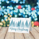 Elegant Winter Träd Anpassningsbar Blue God jul Helgkort<br><div class="desc">En elegant träd och snöflingor över ditt personlig God jul-skript och ditt familjs efternamn i söt blå nedanför den snö fyllda skogen. Ett modernt helgdag-kort med ditt anpassningsbar-meddelande.</div>