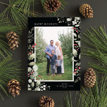 Elegant Winter Watercolor Greenery Botanical Photo Julkort<br><div class="desc">This elegant holiday photo card features a single vertical photo framed by beautiful watercolor eucalyptus, holly, and berries over a chic black background. The editable greeting on the front says "Happy Holidays". The back of the card is a coordinating foliage pattern, which can be removed if desired. You can also...</div>