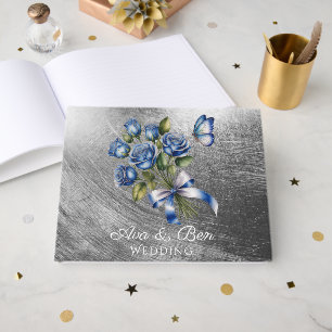 Eleganta blå rosor och silverbröllopsfjäril gästböcker