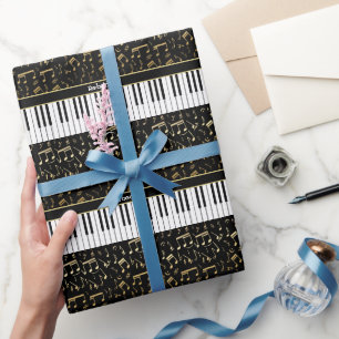 Eleganta guld- musik noterpianonycklar presentpapper