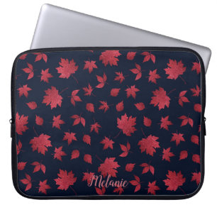 Eleganta röda höstlöv på svart personlig laptop fodral
