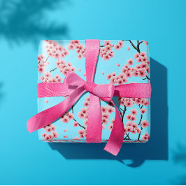 Eleganta rosa körsbärsblommor på himmelblå presentpapper