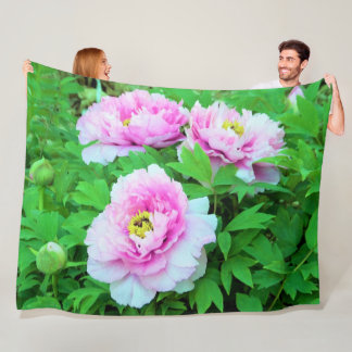 Eleganta rosa trädtujningar med gul center fleecefilt