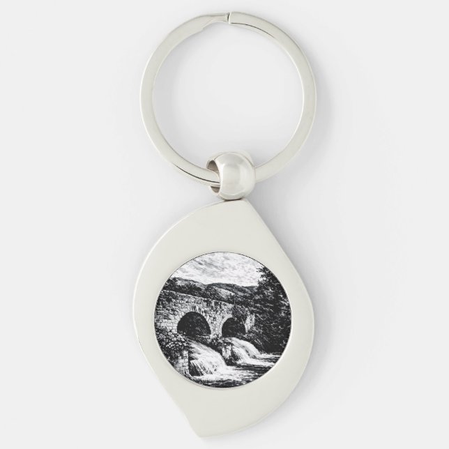 Elegante e pratica, perfetta per ogni occasi swirl silverfärgad nyckelring (Framsidan)
