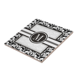 Elegantens svartvita dämpningsmönster och monogram kakelplatta