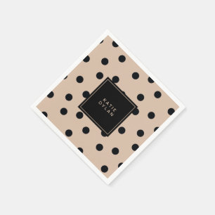 Elegantsvarten pricker på beige pappersservett