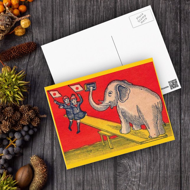 Elephant on Seesaw med Camera Children Vykort (Elephant on seesaw with children waving Japanese flags on red and yellow postcard.)