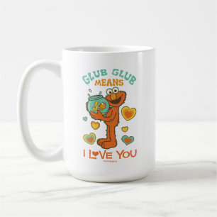 Elmo håller sin guldfisk kaffemugg