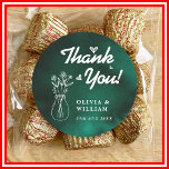 Emerald Green Wildflower Wedding Thank You Runt Klistermärke<br><div class="desc">Emerald Green Wildflower Wedding Thank You Classic Round Sticker | Elegant Gold Luxe Floral Favor Seal Add a beautiful finishing touch to your wedding favors and envelopes with our exquisite Emerald Green Wildflower Wedding Thank You Classic Round Sticker! This charming sticker features lush emerald green botanical wildflowers, elegantly accented with...</div>