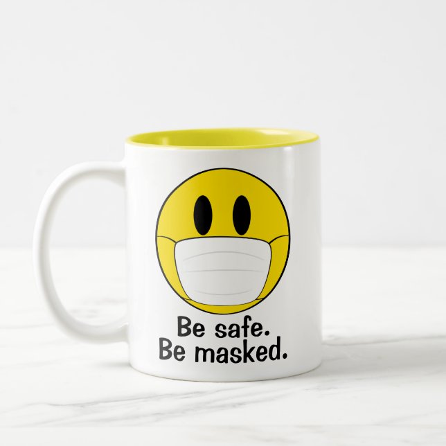 Emoji med masken Illustrerad Två-Tonad Mugg (Vänster)