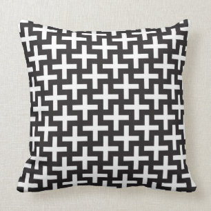 En b&w mönstrar gjort med "plus" undertecknar kudde