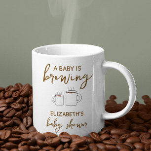 En Baby håller på att blåsa babyskabruk Kaffemugg