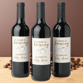 En Baby håller på att blåsa babyskabruk Vinflaska Etikett