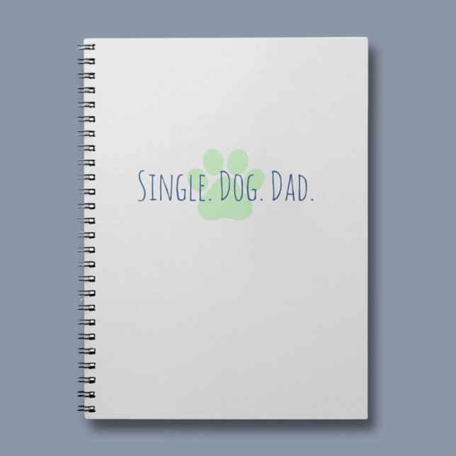 En bärbar dator med bästa Hund Pappa Anteckningsbok (A notebook for the Single Dog Dad. A great place to keep all of your important information safe. )