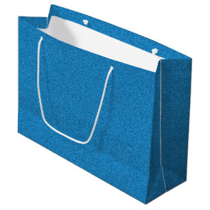 En blå presentpåse med vita handtag
