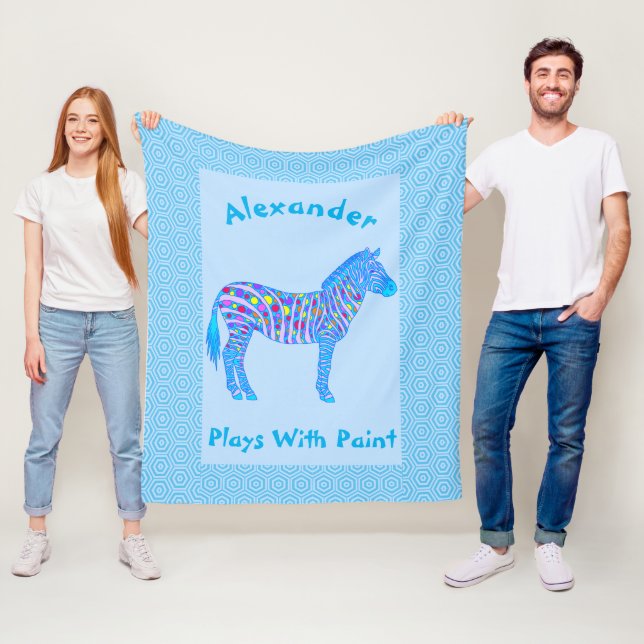 En blåttsebra pricker randar som lekar med målar fleecefilt (På plats)