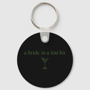 En bricka i en liten bit Bride Svan Martini Bachel Nyckelring