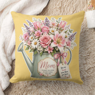 En bukett blommor i en vattenkanna till mamma kudde