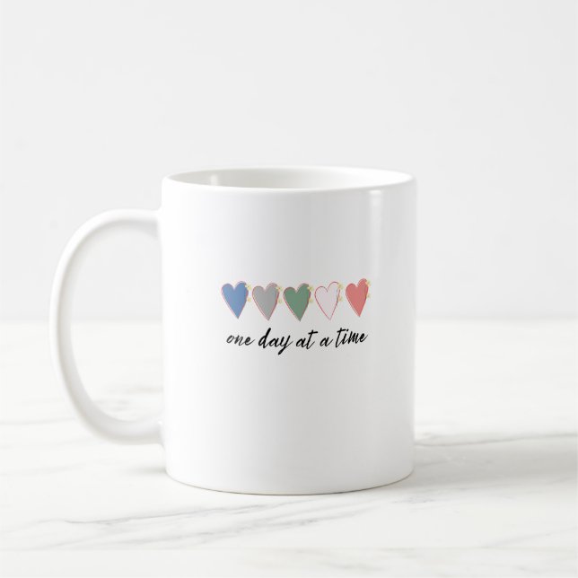 en dag i taget kaffemugg (Vänster)