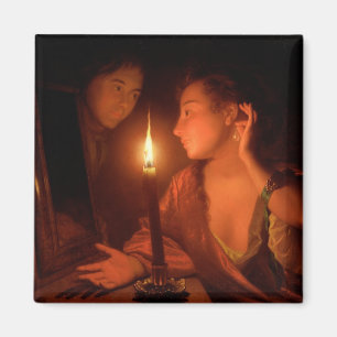 En dam som beundrar ett örhänge vid Candlelight Magnet