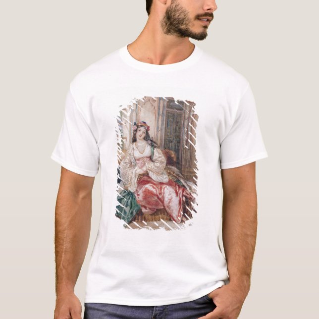 En dam som placeras i en Ottoman inre ha på sig Tee Shirt (Framsida)
