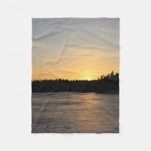 En djupfryst solnedgång fleecefilt