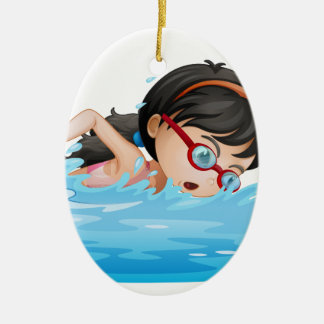 En flickasimning med goggles julgransprydnad keramik