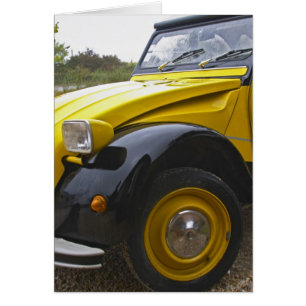 En gammal svart och gul Citroen 2CV 2 CV, Hälsningskort
