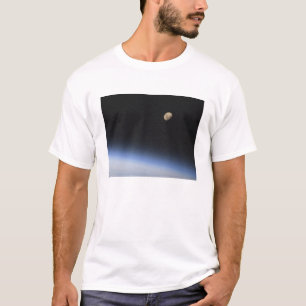 En gibbous måne som är synlig ovanför jord tröja