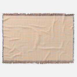 En gingham-rutig filt i beige nyanser