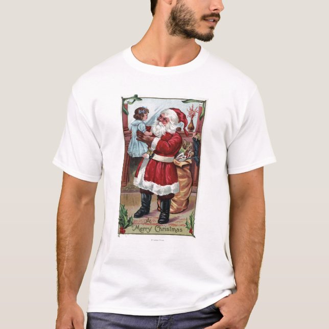 En glad ChristmasSanta hållande flicka i blått T Shirt (Framsida)
