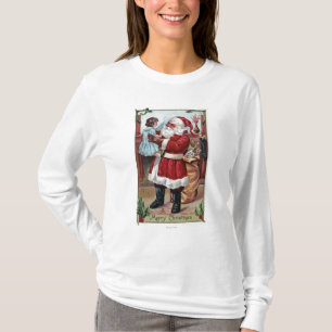 En glad ChristmasSanta hållande flicka i blått Tee