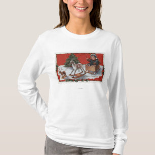 En glada ChristmasKid i enBoxas Sled Tee Shirt