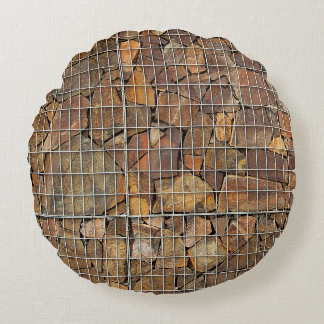 En grungande tegelvägg i struktur som grundförutsä rund kudde (Framsidan)