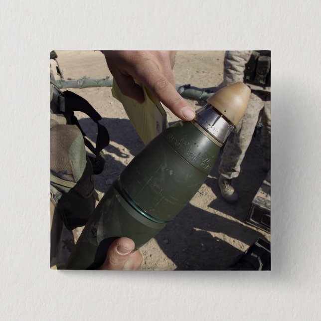 En gruppledare pekar på en fördröjningsinställning knapp (Framsida)