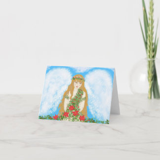 En härlig ängel som slås in i julande. helgkort