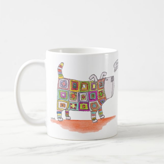 En hund i en kittlig utrustning. kaffemugg (Vänster)