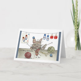 En kanin som drar en julklapp kort