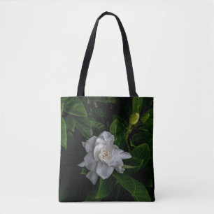 En känslig vit blomma blommar tygkasse