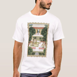 En koppla ihop i en trädgård som lyssnar till tee shirt