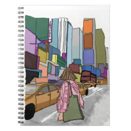 En kvinna går ner på en bustig stadsgata. anteckningsbok